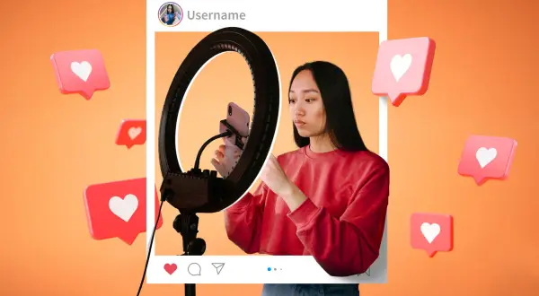 Joven influencer emprendedora graba contenido con aro de luz. Corazones flotantes celebran su éxito en redes.